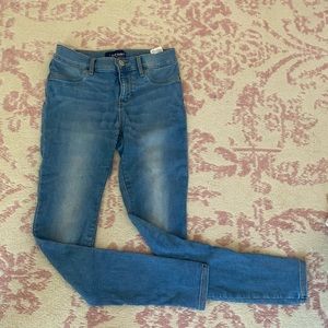 Light wash non ripped jeans.